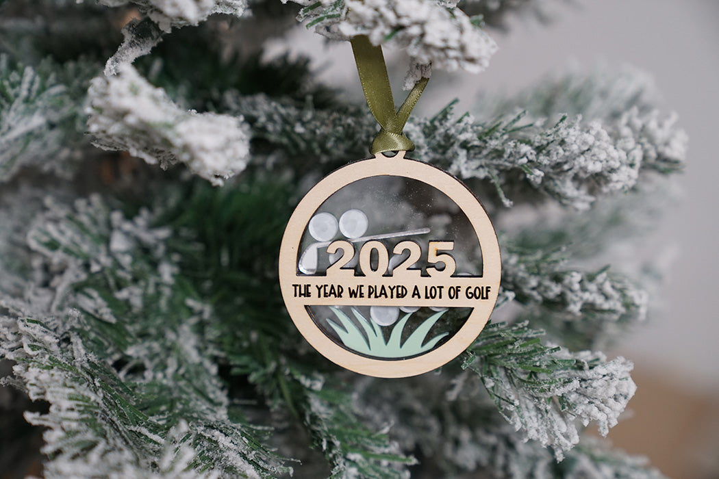 Wooden ornament with '2025 The Year We Played a Lot of Golf'